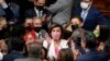Speaker of the House Nancy Pelosi, D-Calif., celebrates the House passage of President Joe Biden's expansive social and environment bill with other Democrats in the House Chamber, at the Capitol in Washington on Nov. 19, 2021.