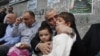 Senior Hamas leader Ismail Haniyeh kisses the son of Hamas military chief, who was killed by an Israeli air strike, as he consoles the family in Gaza City November 22, 2012.