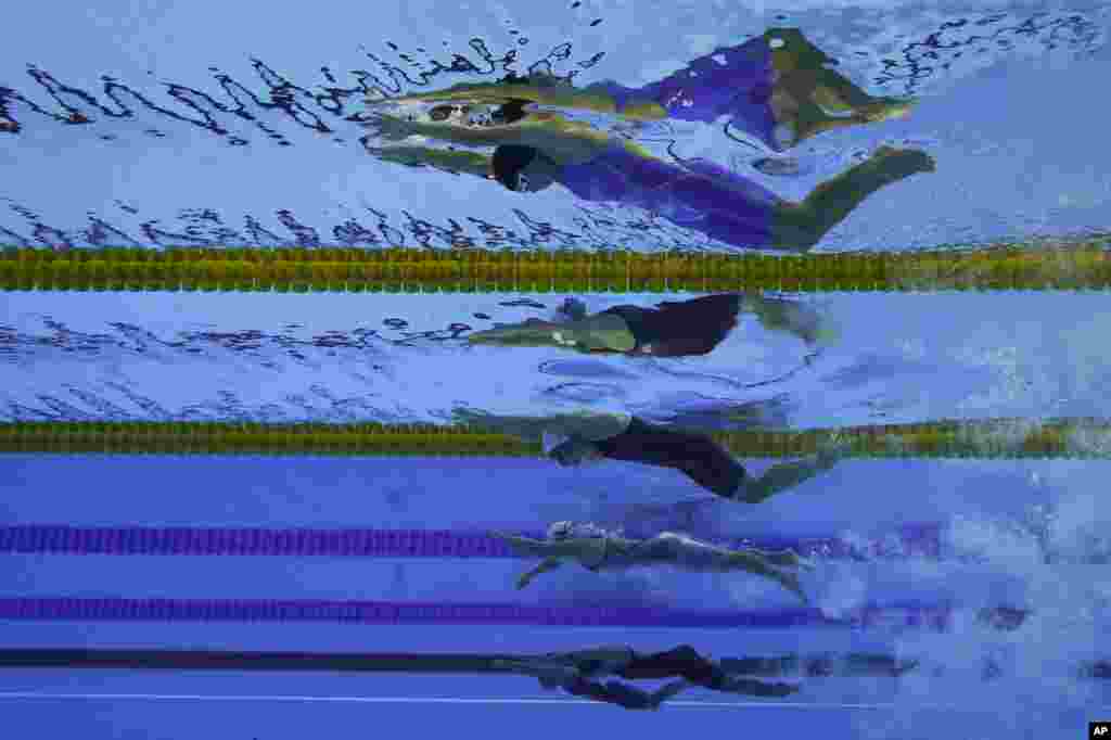 Swimmers from top to bottom; Uzbekistan's Shokhsanamkhon Toshpulatova, Ukraine's Anna Stetsenko, Poland's Joanna Mendak, Uzbekistan's Muslima Odilova and Fotimakhon Amilova compete in the Women's 100m Freestyle at the Paralympic Games in Rio de Janeiro, Brazil.