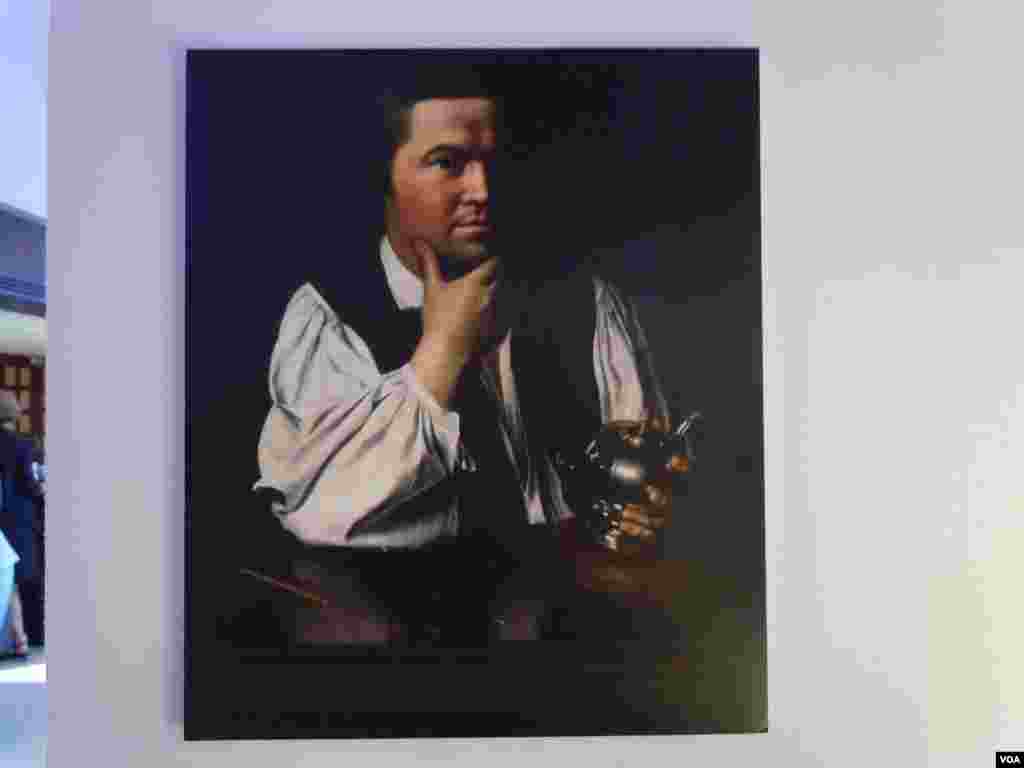 Painting of Paul Revere (1734-1818) with one of his teapots. (VOA/J. Taboh)