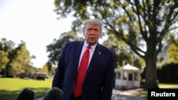 FILE - U.S. President Donald Trump talks to reporters as he departs for campaign travel to Ohio from the South Lawn at the White House in Washington, Sept. 21, 2020.