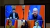 FILE - European Commission President Ursula von der Leyen, European Council President Charles Michel, German Chancellor Angela Merkel, French President Emmanuel Macron and Chinese President Xi Jinping hold a video conference, Dec. 30, 2020.
