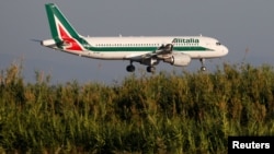 An Alitalia Airbus A320-200 airplane approaches to land at Fiumicino airport in Rome, Italy, Oct. 24, 2018.