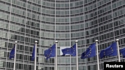 European Union flags are seen outside the European Commission headquarters in Brussels in this Oct. 27, 2010. (file photo)